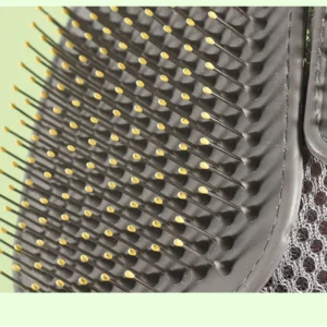 Close-up of needle comb and mesh surface on pet bath glove for massage and shedding control