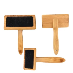Bamboo fine-toothed pet needle combs displayed on shelf in pet store for retail sale