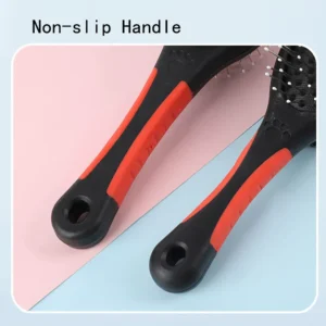 Close-up of stainless steel pin side of double-sided pet brush for detangling