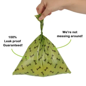 10004 Dog owner walking with eco-friendly poop bag dispenser and biodegradable waste bags outdoors