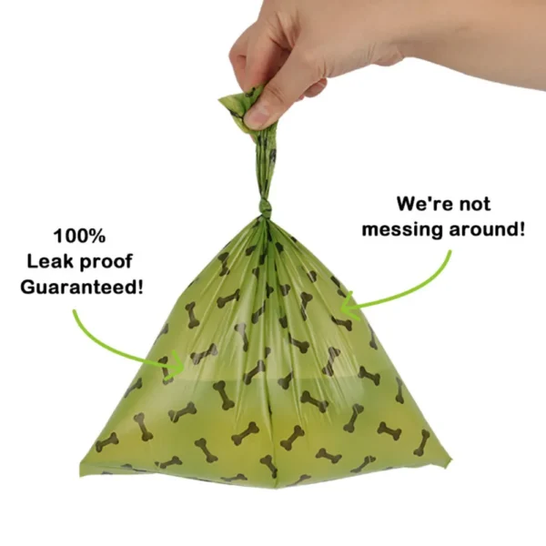 10004 Dog owner walking with eco-friendly poop bag dispenser and biodegradable waste bags outdoors