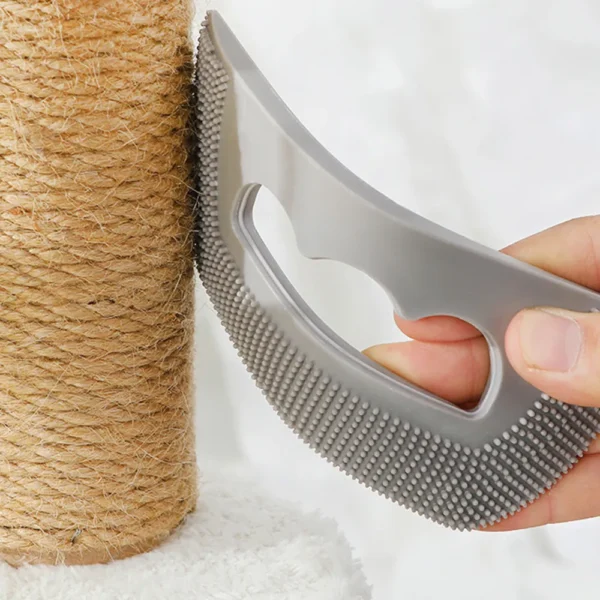 10006 Pet Owner Using Grey TPR Mini Pet Hair Remover on Sofa Fabric