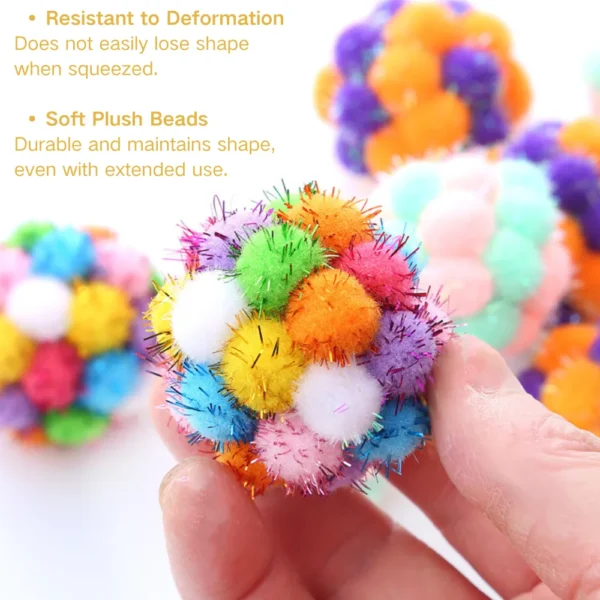 10001 Close-up of glitter texture and bell inside colorful cat toy ball