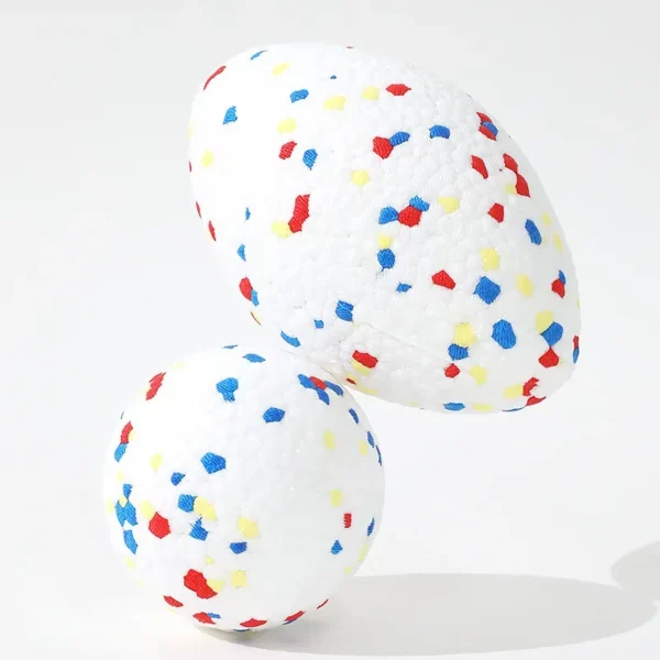 10002 Close-up of textured surface and durable TPR material of rugby-style dog ball