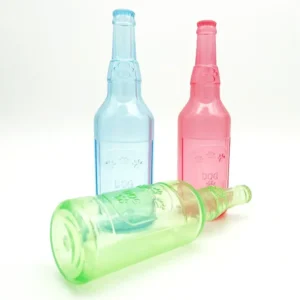 Dog playing with rubber squeaky bottle chew toy indoors