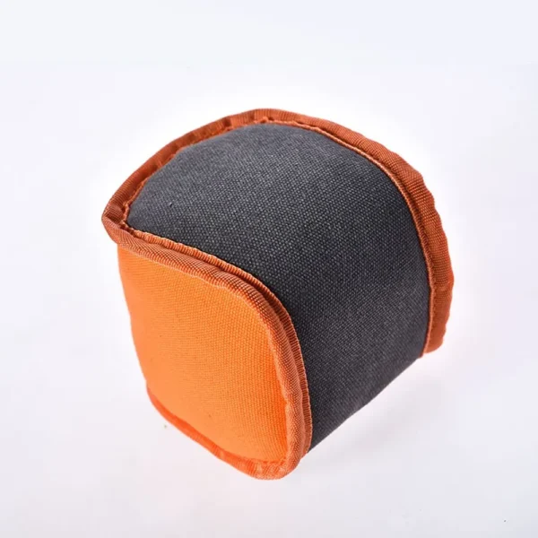 10002 Close-up of chew cube dog toy with reinforced stitching and squeaky design for durability.