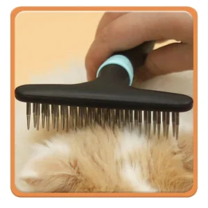 Double row pet brush removing loose fur and undercoat from cat