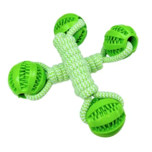 Dog playing tug-of-war with cotton rope chew toy outdoors