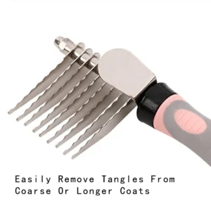 Pet groomer using stainless steel dematting comb to remove tangles from dog’s coat