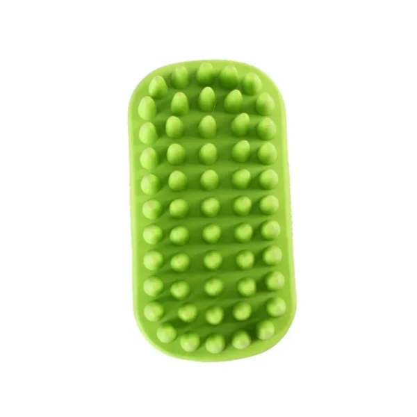 10004 Pet owner using green rubber bath brush to groom dog during bath