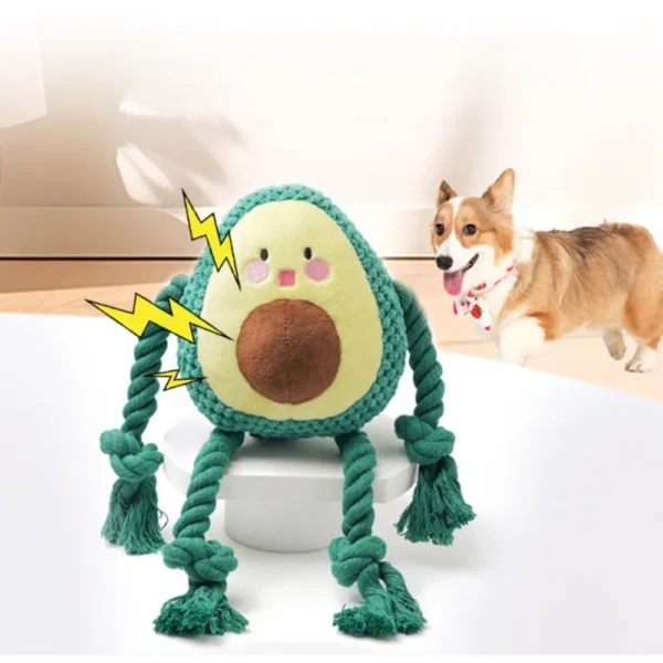 6ebdc7d6b31611907f1c8733fd0b7f66 Dog playing with avocado plush squeaky rope toy indoors