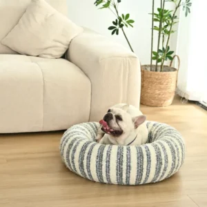 Anti-slip bottom and plush padding of XS striped donut pet bed.