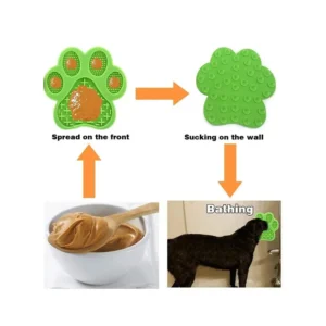 Pet owner applying peanut butter on silicone lick mat with suction base sticking to wall or floor for calming bath sessions