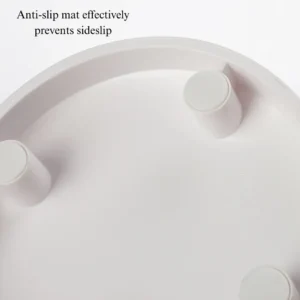 daa4e458850600e31b90f65904e3e6f3 Close-up of tilted raised cat bowl showing ergonomic design and smooth edges