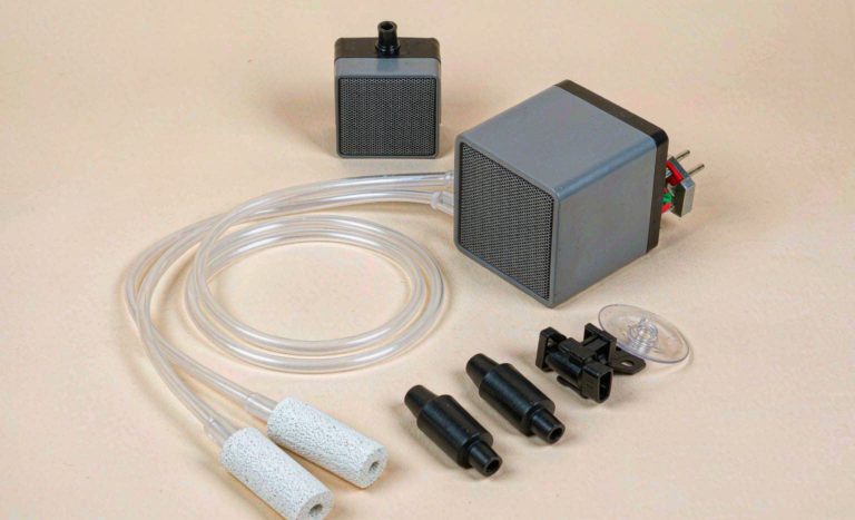 Aquarium air pumps with airline tubing air stones and check valves flat lay